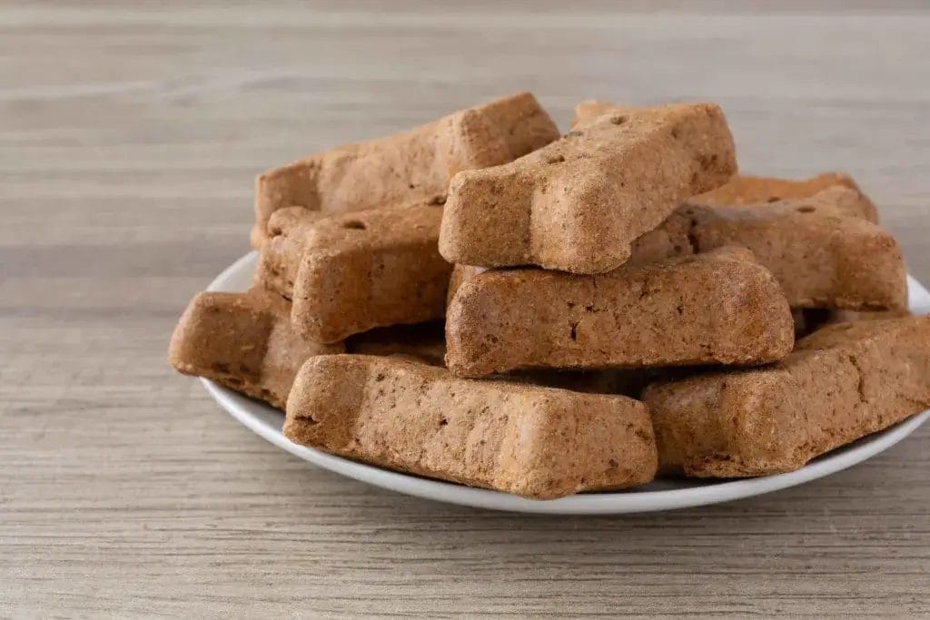 Peanut butter dog treats on a plate.
