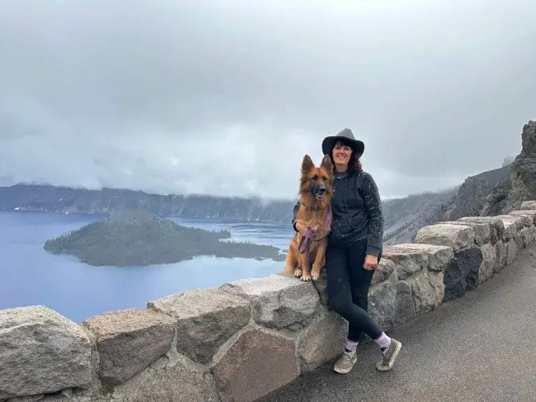 Woman and German Shepherd dog at Crater Lake.