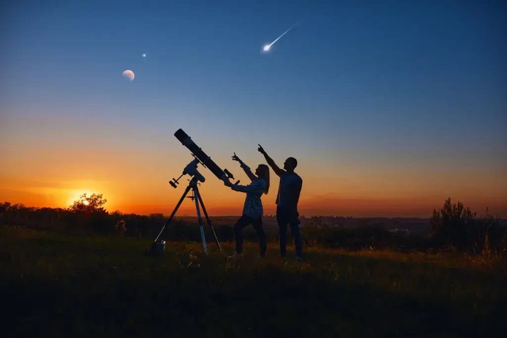 Friends stargazing at sunset.