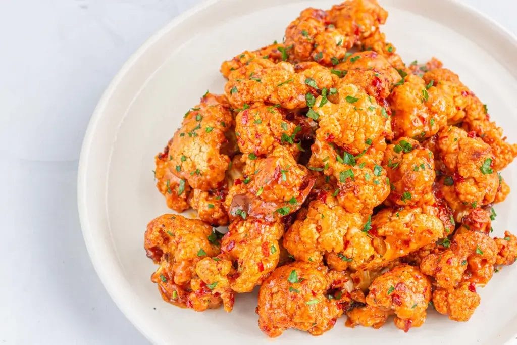 Buffalo cauliflower on a white bowl.