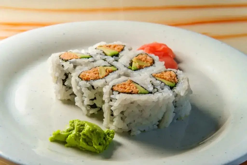 Spicy Tuna Sushi rolls on a white plate.