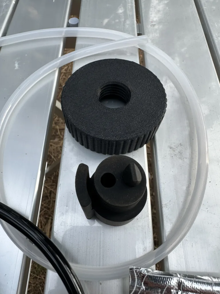 Geyser Clean Kit components sitting on a silver table at camp.