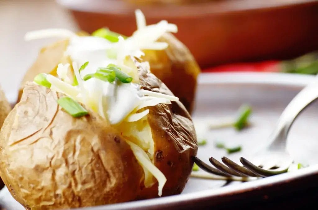 Baked Potato with chives, cheese, and sour cream