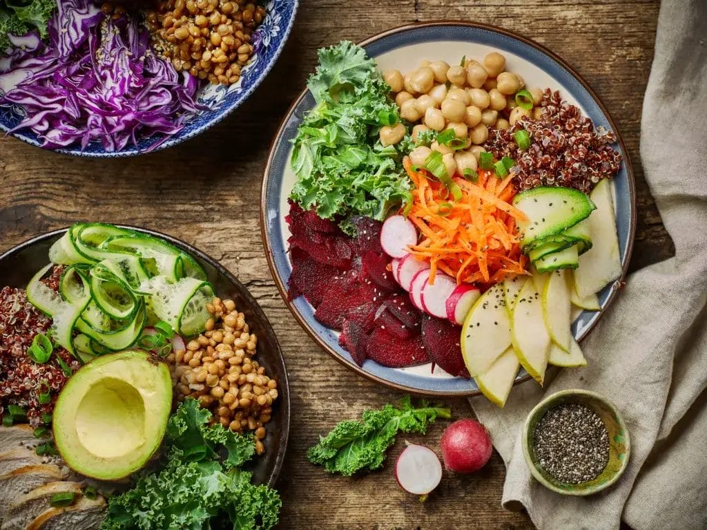 Breakfast power bowls for healthy eating on wooden kitchen table, top view