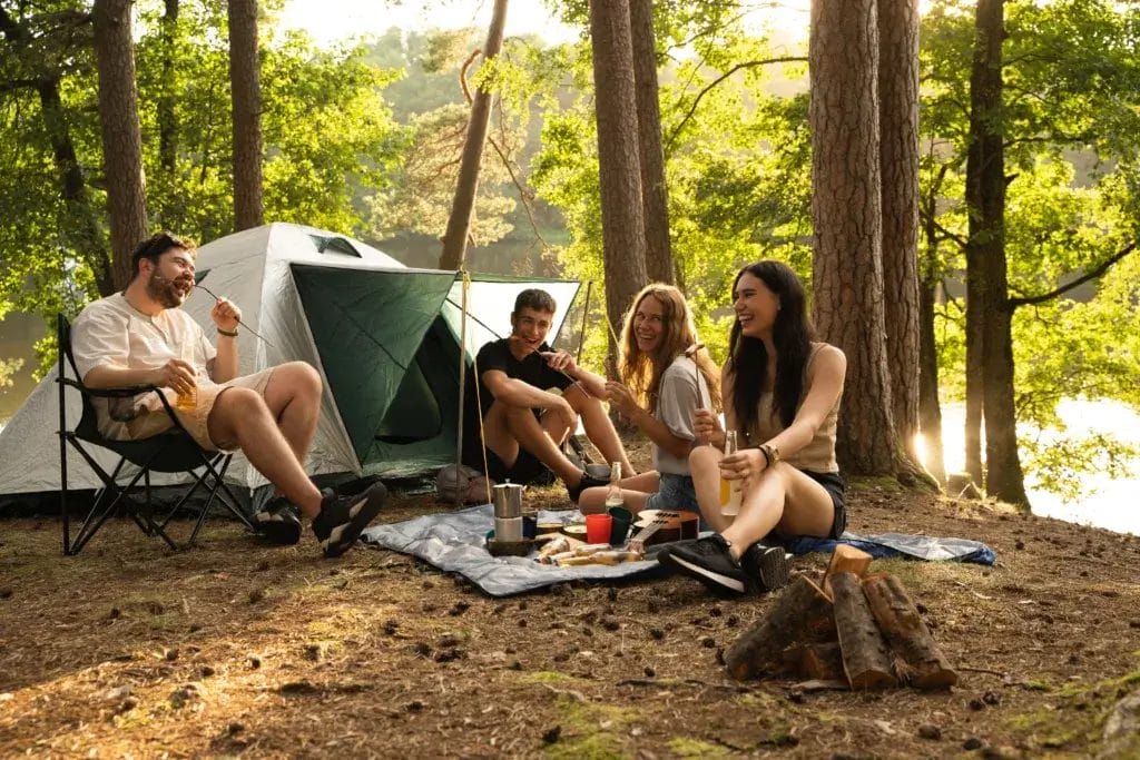 Friends at camp are enjoying a healthy meal.