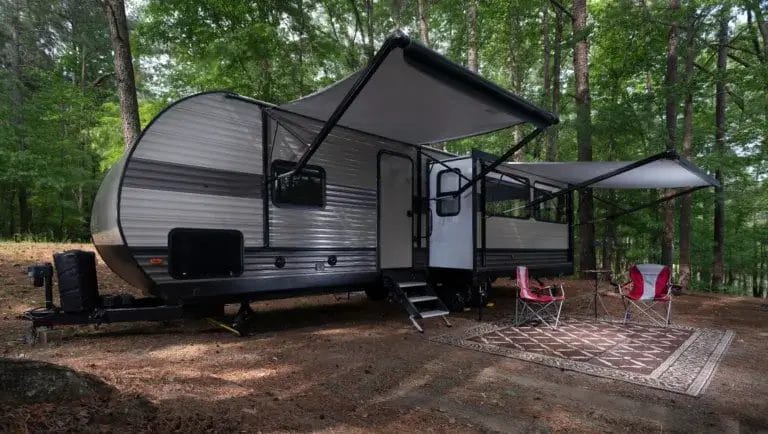 Parked RV with the awning set up.